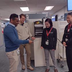 Sachie Dr Oh Vinay Karl standing in the lab